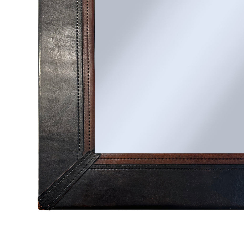 Corner detail of Rectangular leather wrapped mirror
