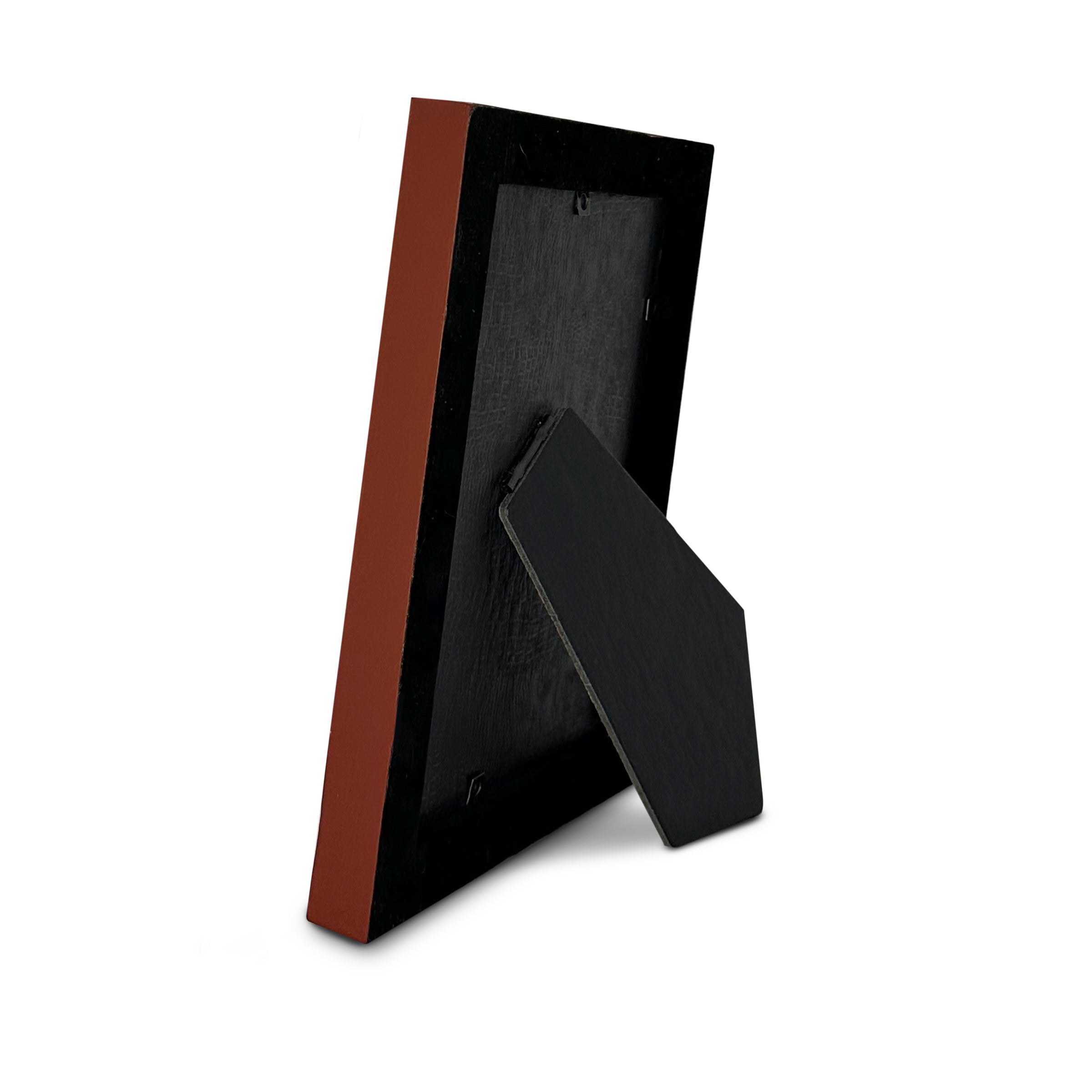 Black velvet lining and red matte side picture frame on a white background
