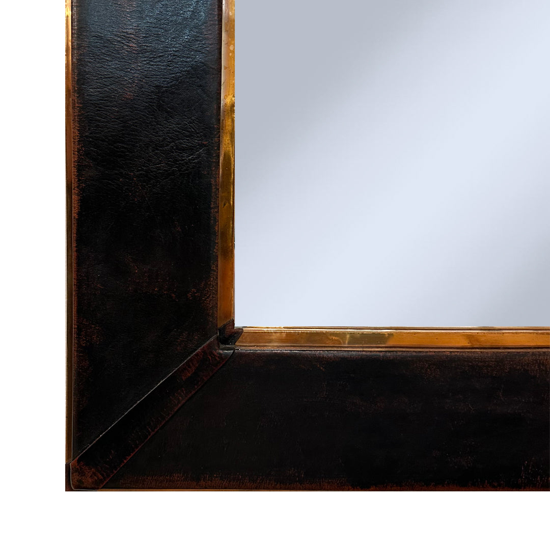 corner detail of leather wrapped framed mirror