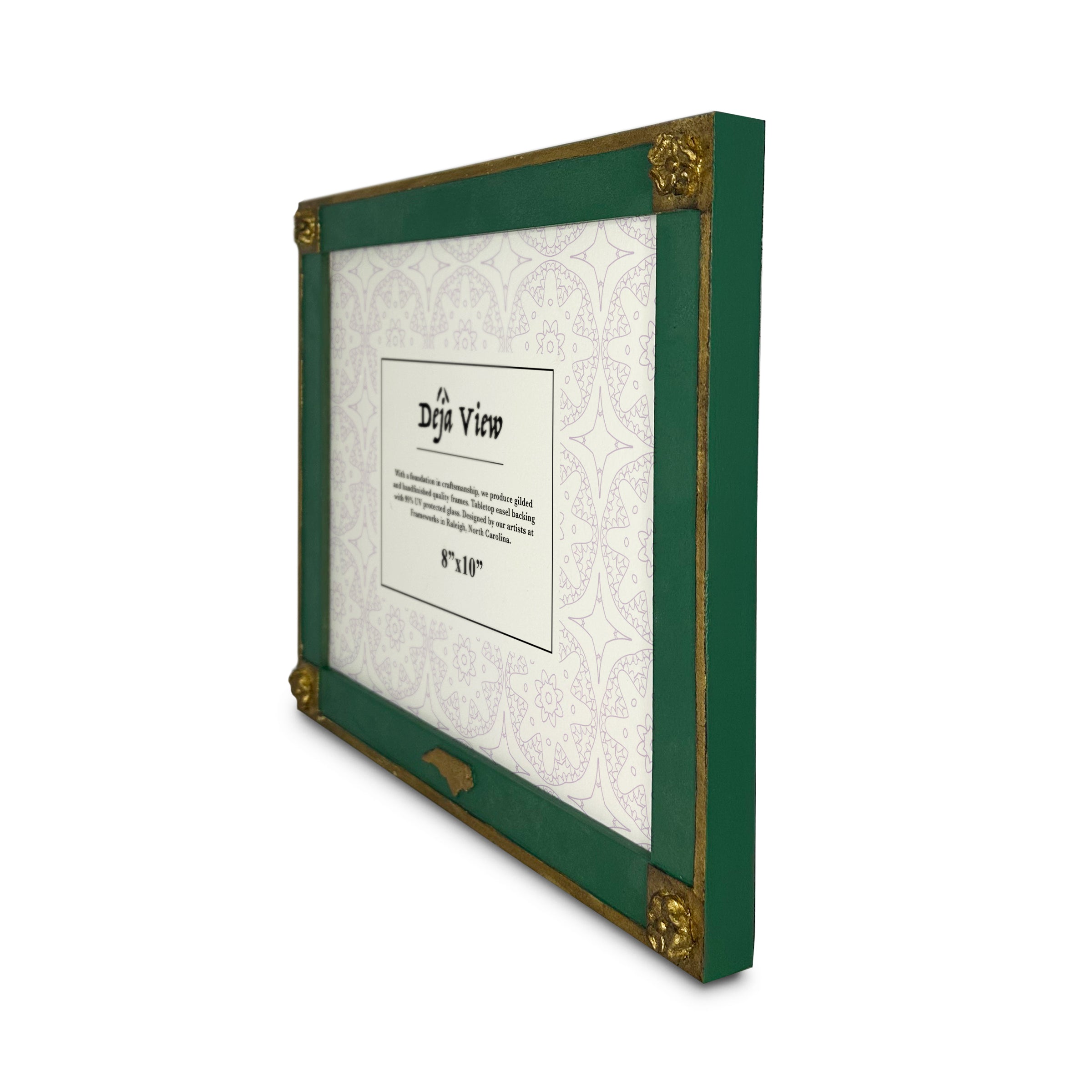 Green and gold picture frame with a decorative backing on a white background