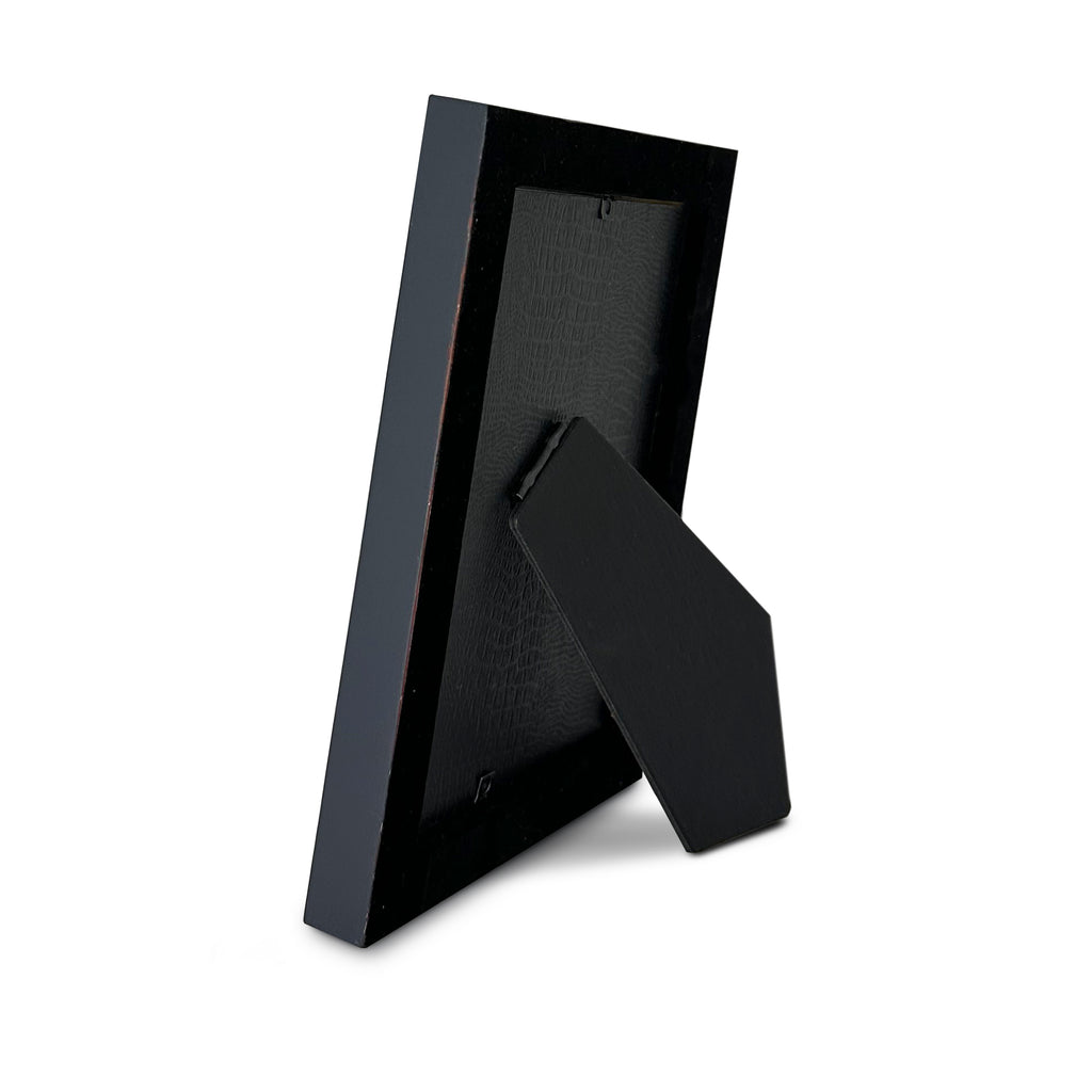Black velvet lined back of Patriot photo frame with blue sides and easel back stand on a white background