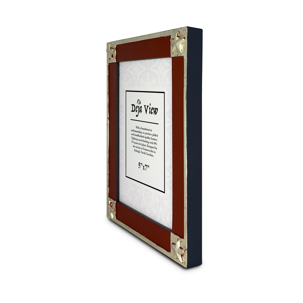 Handmade decorative picture frame with red,blue and white gold accents on a white background